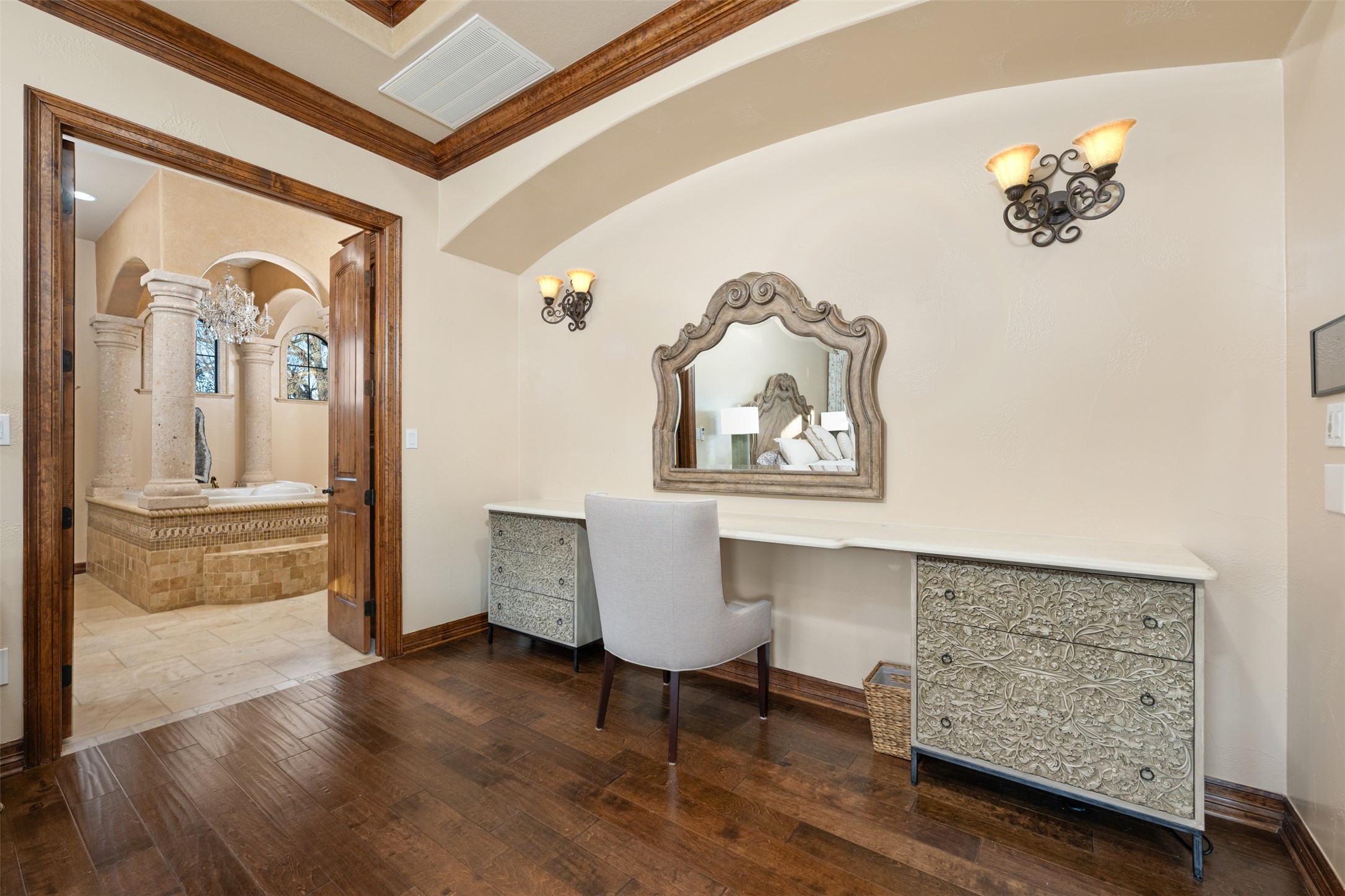 101 Hopewell Circle Georgetown, TX 78628 - Photo 16 of 38 Office area featuring arched walkways, dark wood-style flooring, built in desk, and ornamental molding