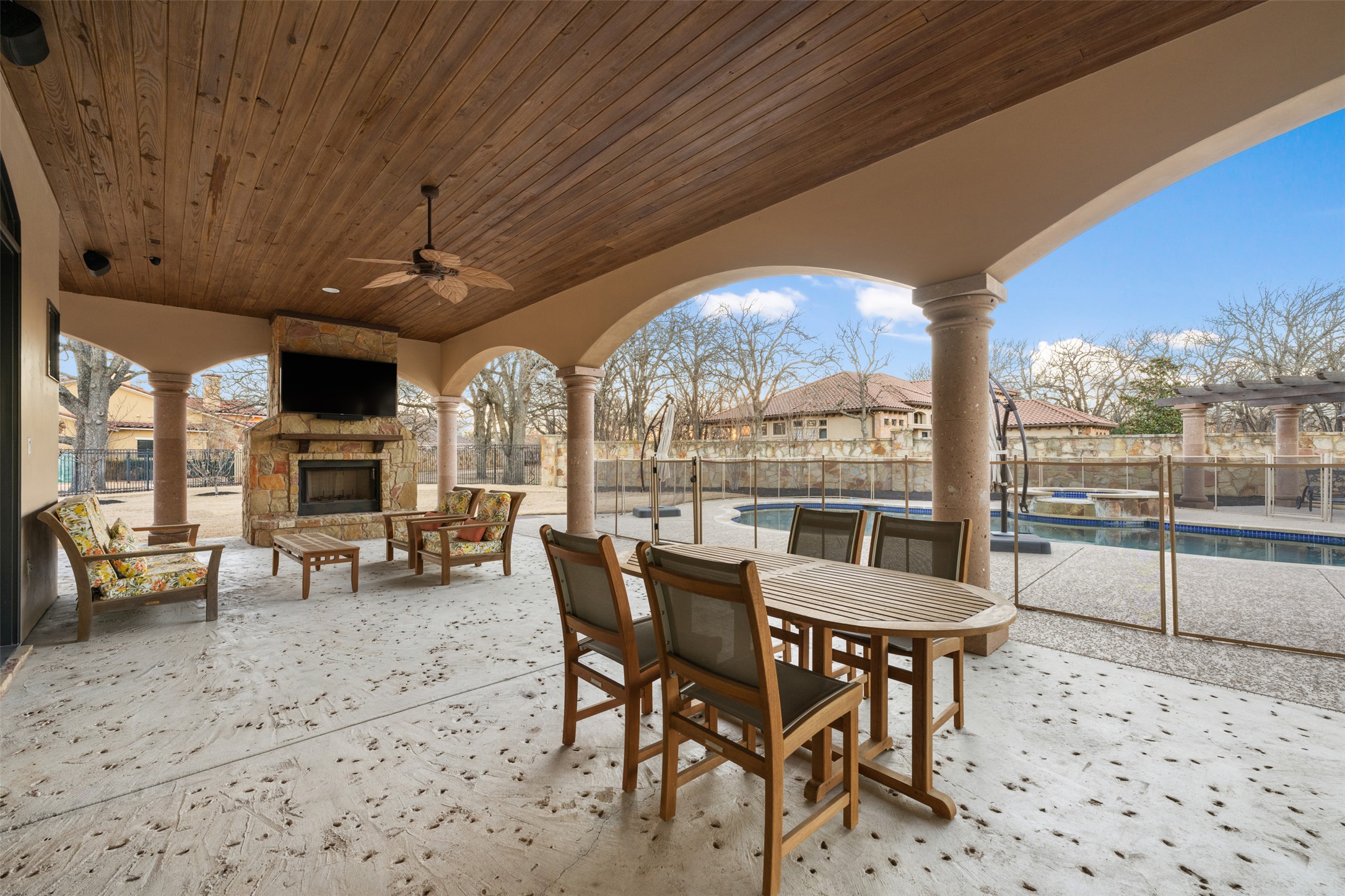 101 Hopewell Circle Georgetown, TX 78628 - Photo 19 of 38 Fenced backyard with a patio area, an outdoor stone fireplace, ceiling fan, outdoor lounge area, and a pool with connected hot tub