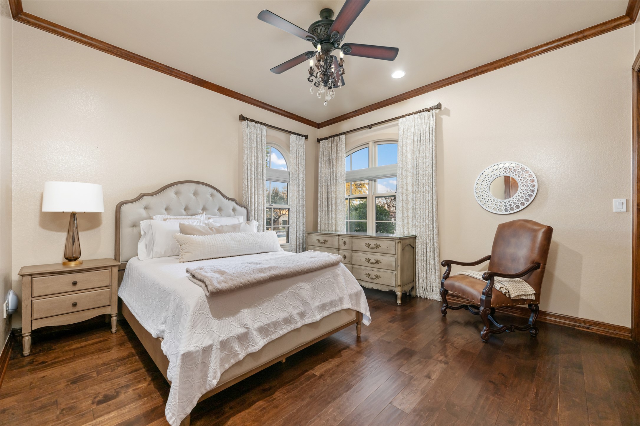 101 Hopewell Circle Georgetown, TX 78628 - Photo 24 of 38 Bedroom with dark wood-style floors, ceiling fan, and ornamental molding