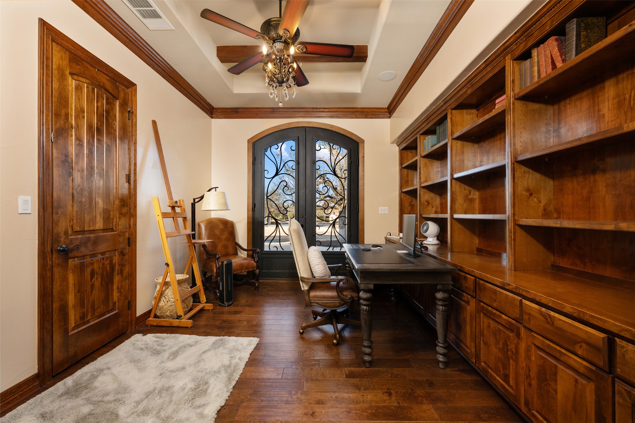 101 Hopewell Circle Georgetown, TX 78628 - Photo 28 of 38 Home office with french doors, ornamental molding, dark wood-style flooring, ceiling fan, and a tray ceiling