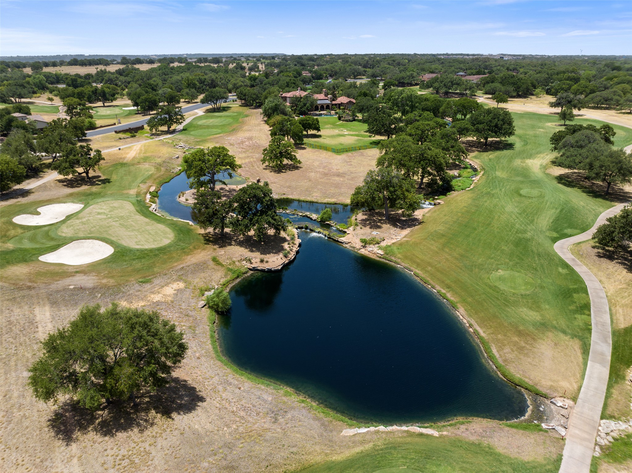 101 Hopewell Circle Georgetown, TX 78628 - Photo 37 of 38 Aerial view of property's location with a golf club and a nearby body of water