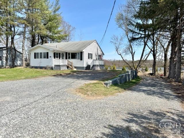 207 Stottville Road Hudson, NY 12534 - Photo 3 of 33 a front view of a house with a yard and large trees