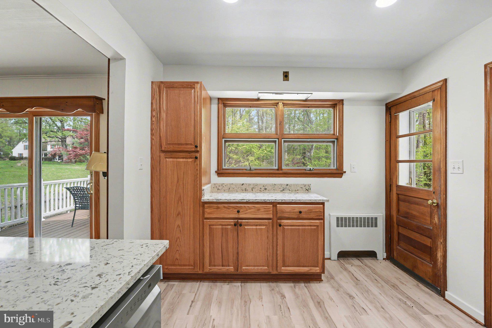 3418 Walnut Road Aberdeen, MD 21001 - Photo 13 of 38 a kitchen with a stove and wooden floor