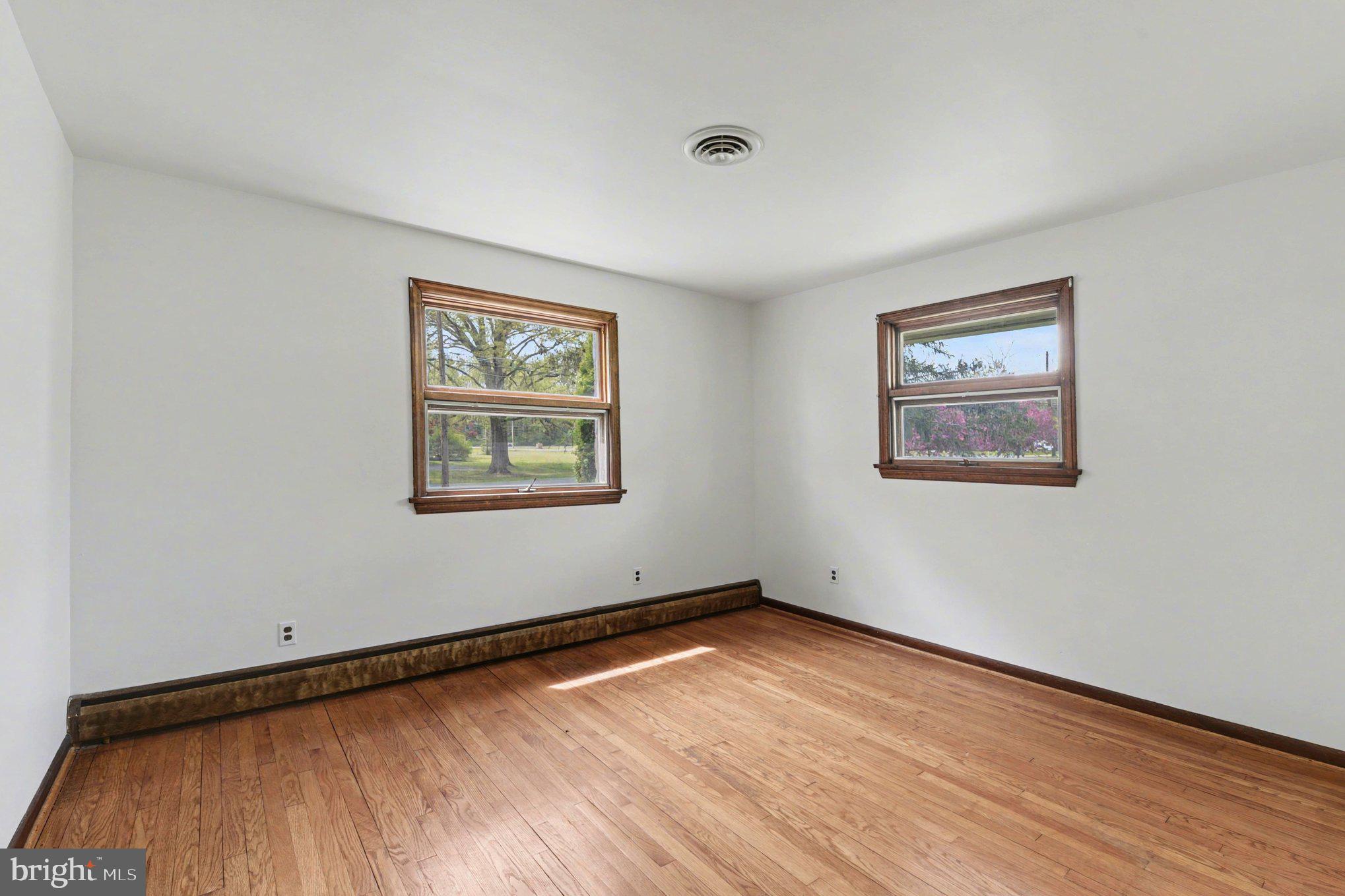 3418 Walnut Road Aberdeen, MD 21001 - Photo 24 of 38 an empty room with wooden floor and windows