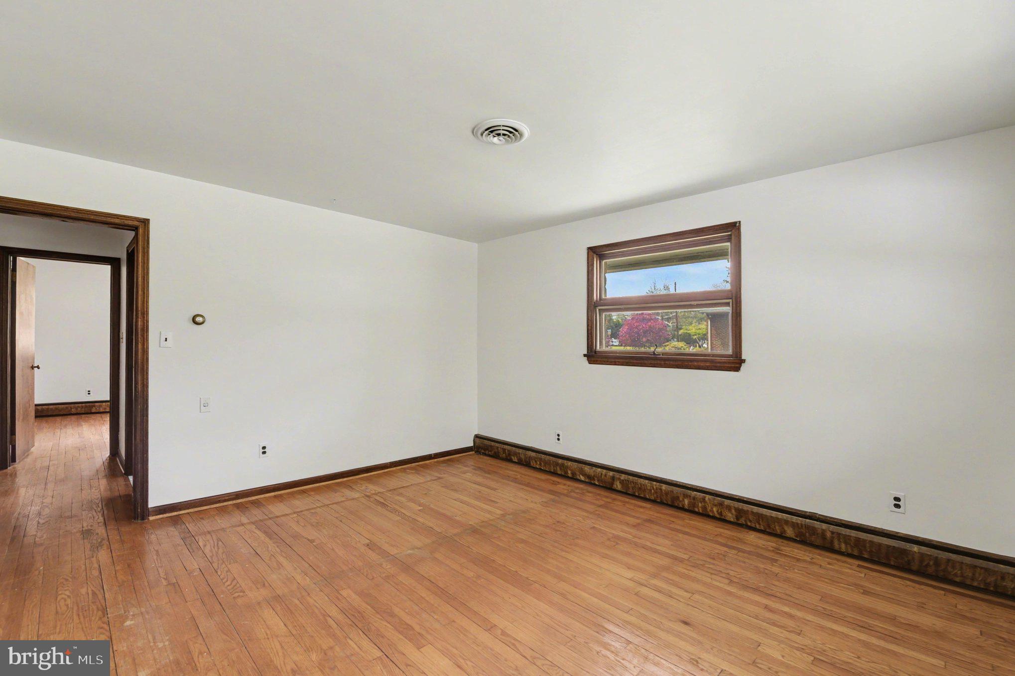 3418 Walnut Road Aberdeen, MD 21001 - Photo 26 of 38 an empty room with wooden floor and windows