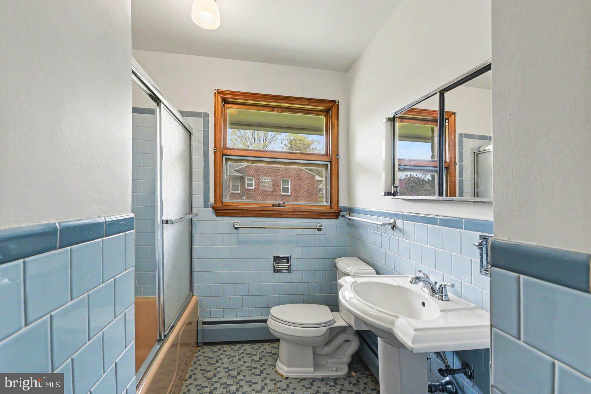 3418 Walnut Road Aberdeen, MD 21001 - Photo 27 of 38 a bathroom with a sink a toilet and mirror