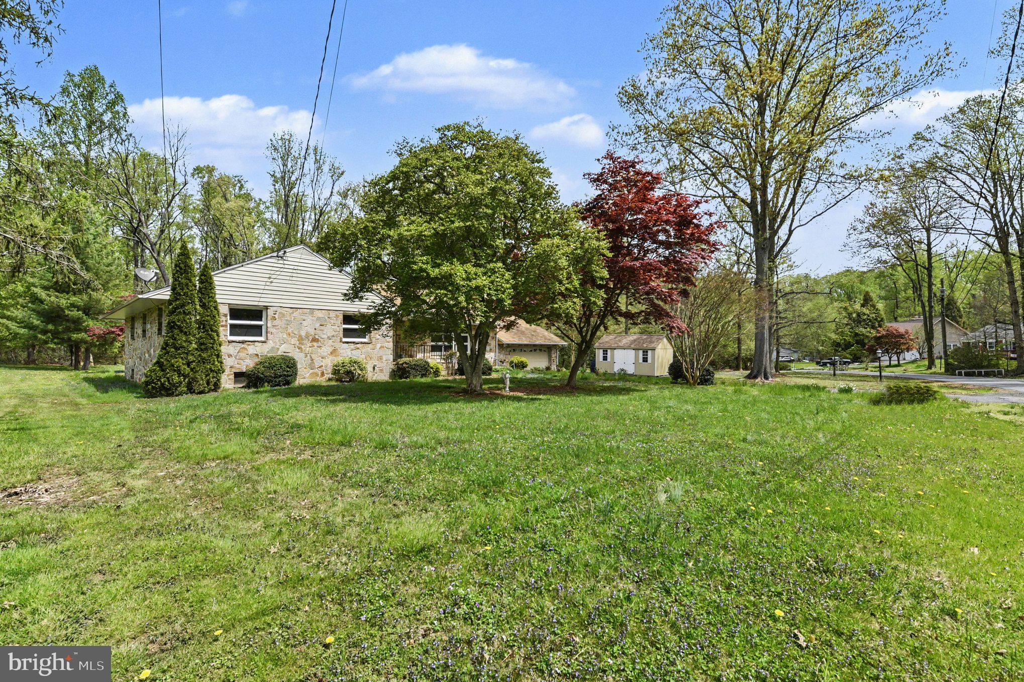 3418 Walnut Road Aberdeen, MD 21001 - Photo 36 of 38 a view of a white house with a big yard and large trees