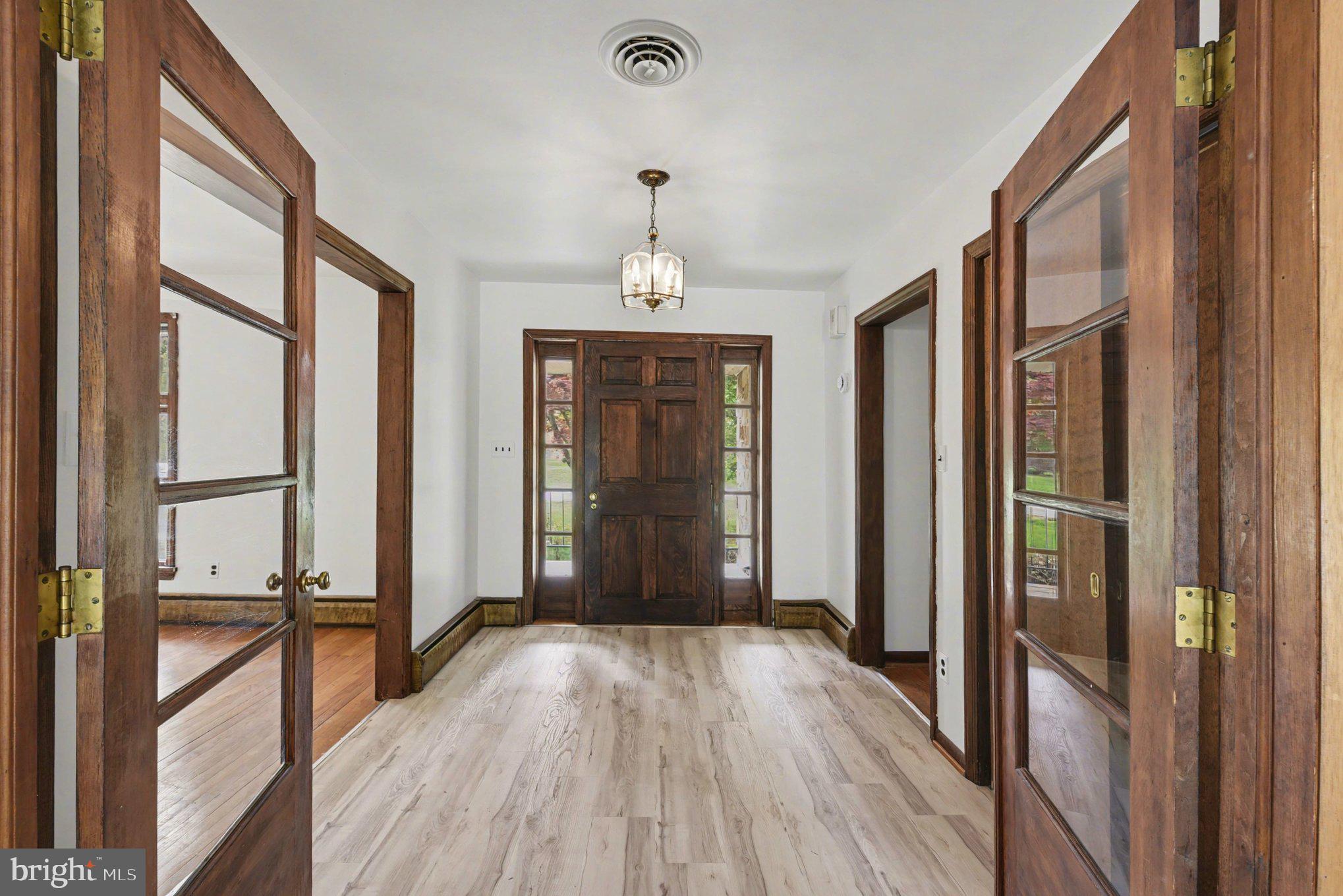 3418 Walnut Road Aberdeen, MD 21001 - Photo 5 of 38 a view of a hallway with wooden floor and staircase