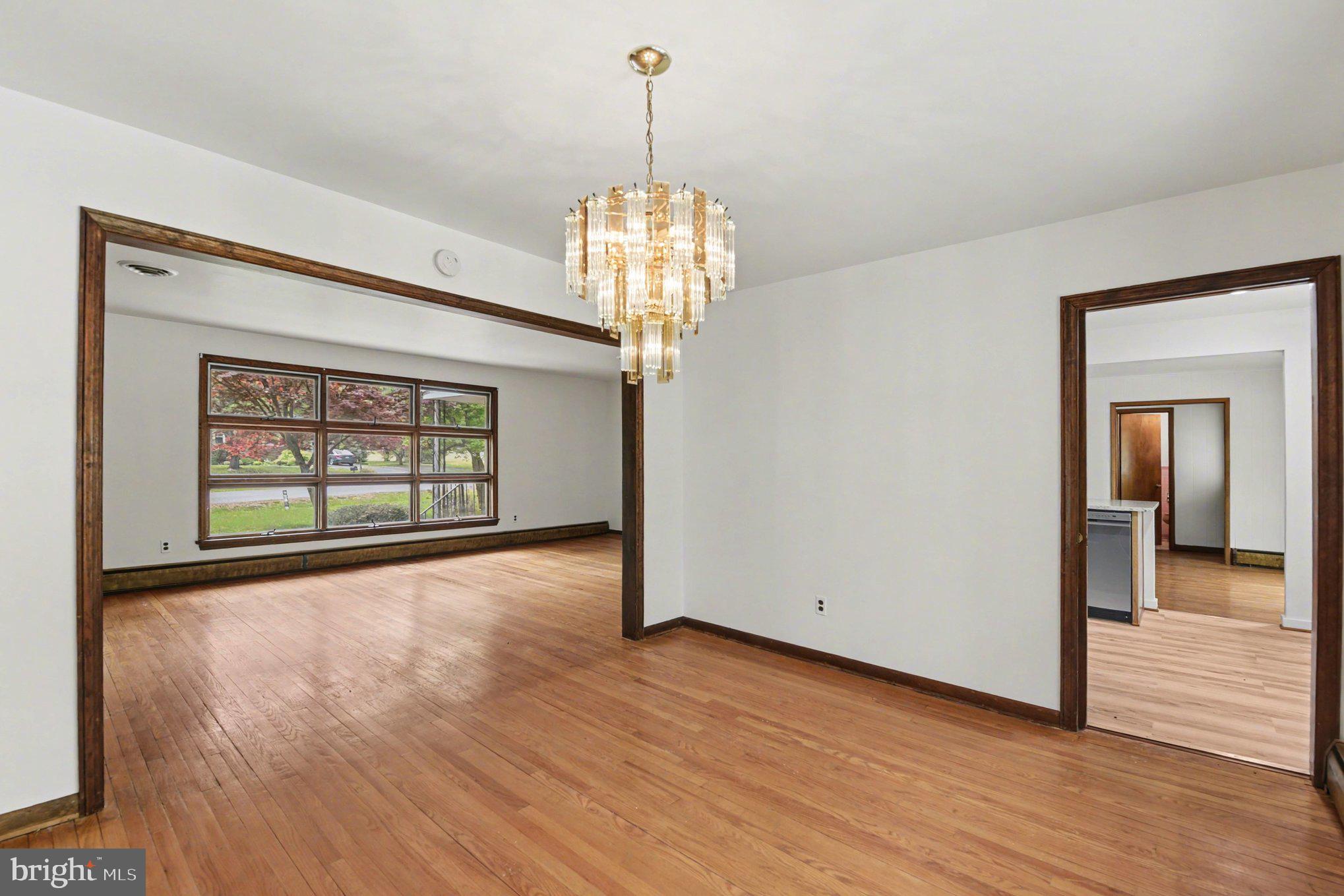 3418 Walnut Road Aberdeen, MD 21001 - Photo 10 of 38 a view of a room with wooden floor chandelier and windows