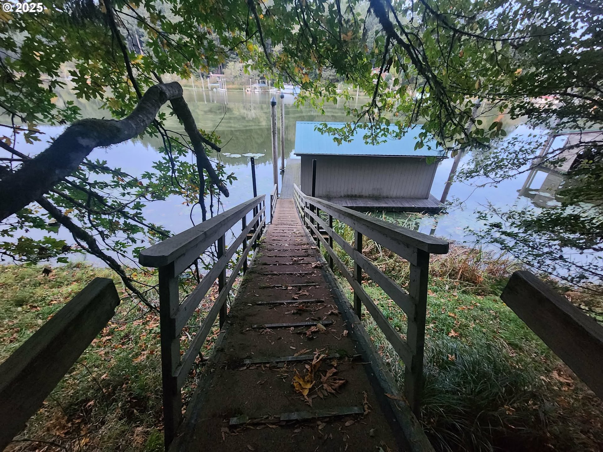 763 North Tenmile Lakeside, OR 97449 - Photo 15 of 47 a balcony with wooden floor and outdoor seating