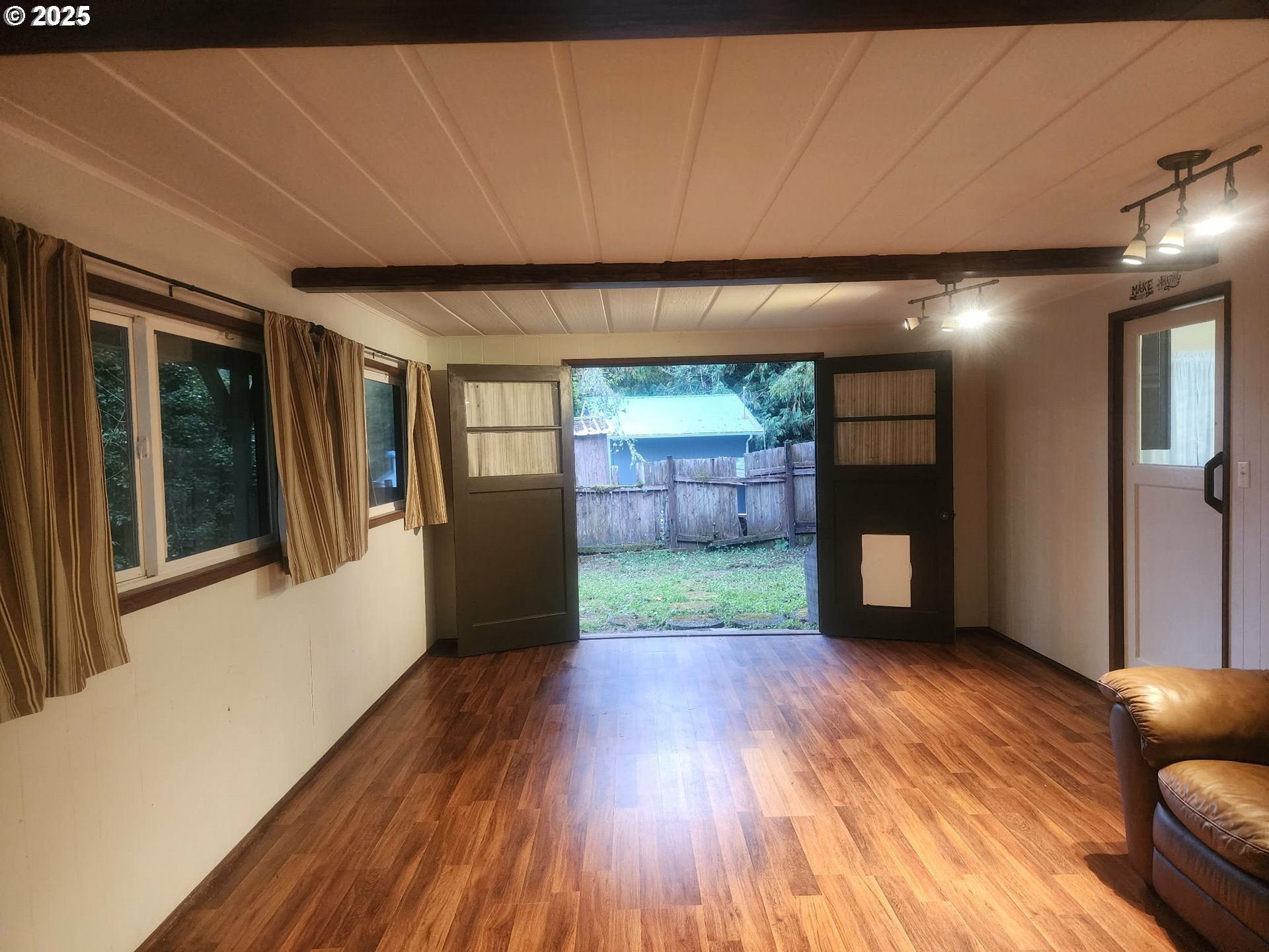 763 North Tenmile Lakeside, OR 97449 - Photo 23 of 47 a view of a livingroom with wooden floor