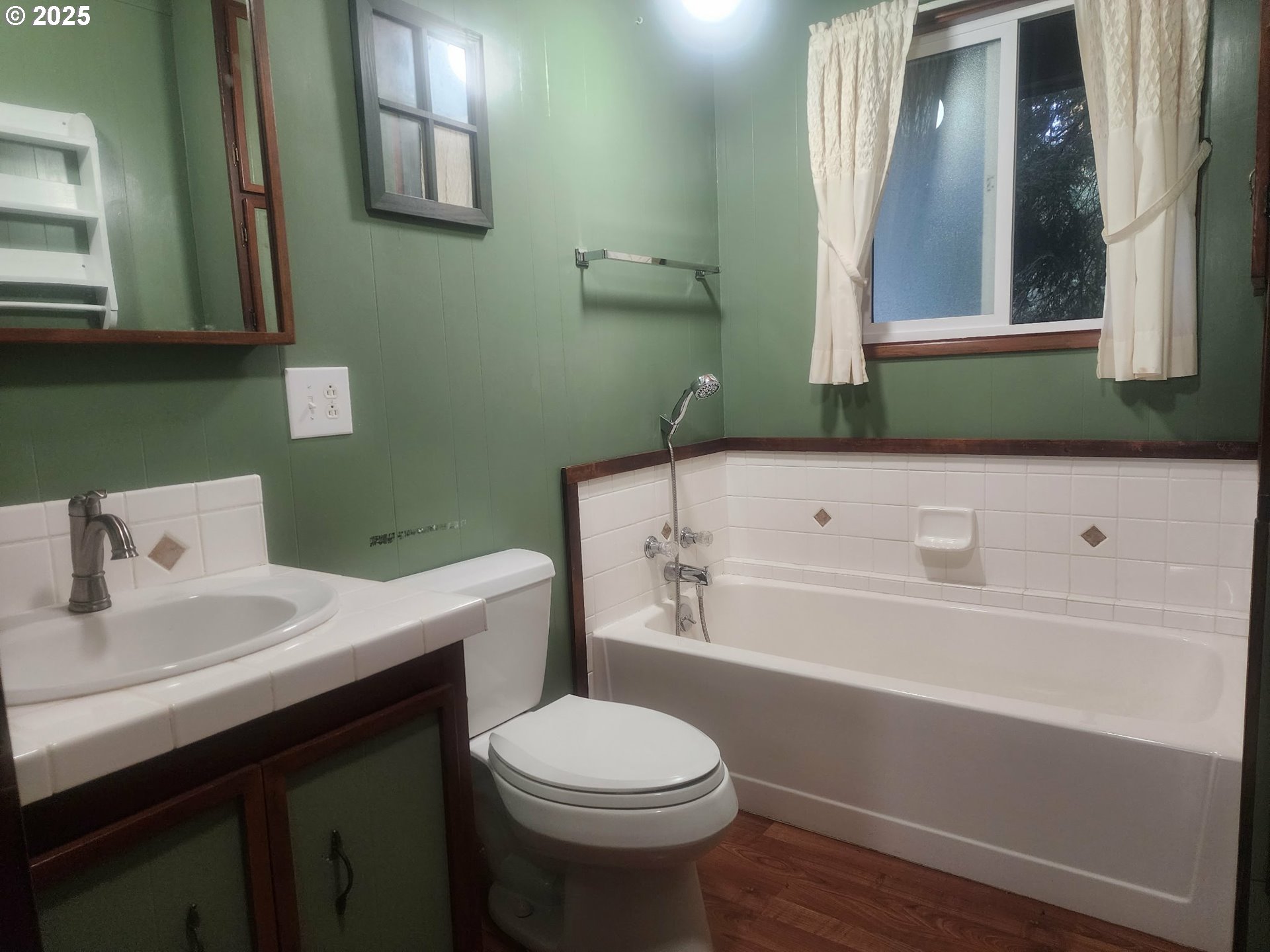 763 North Tenmile Lakeside, OR 97449 - Photo 30 of 47 a bathroom with a sink a toilet and a bathtub