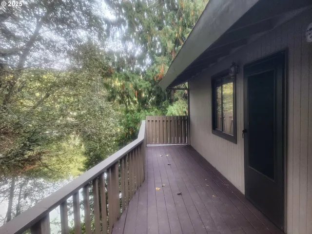 a view of balcony with wooden floor