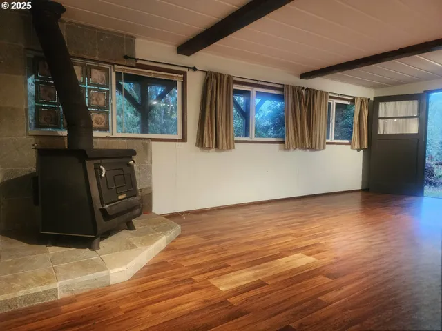 a kitchen with white cabinets and sink