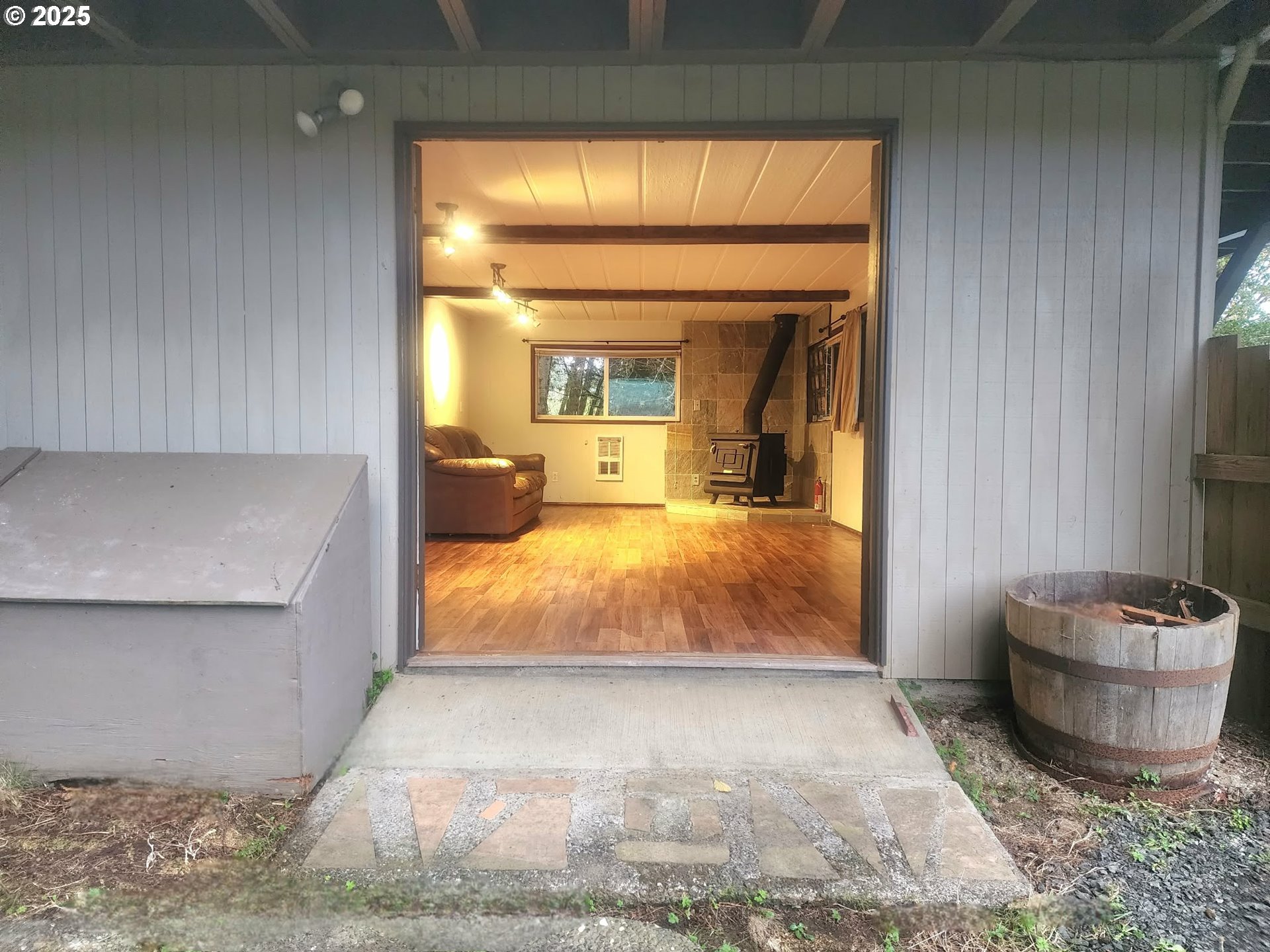763 North Tenmile Lakeside, OR 97449 - Photo 46 of 47 a room with a bed and a potted plant