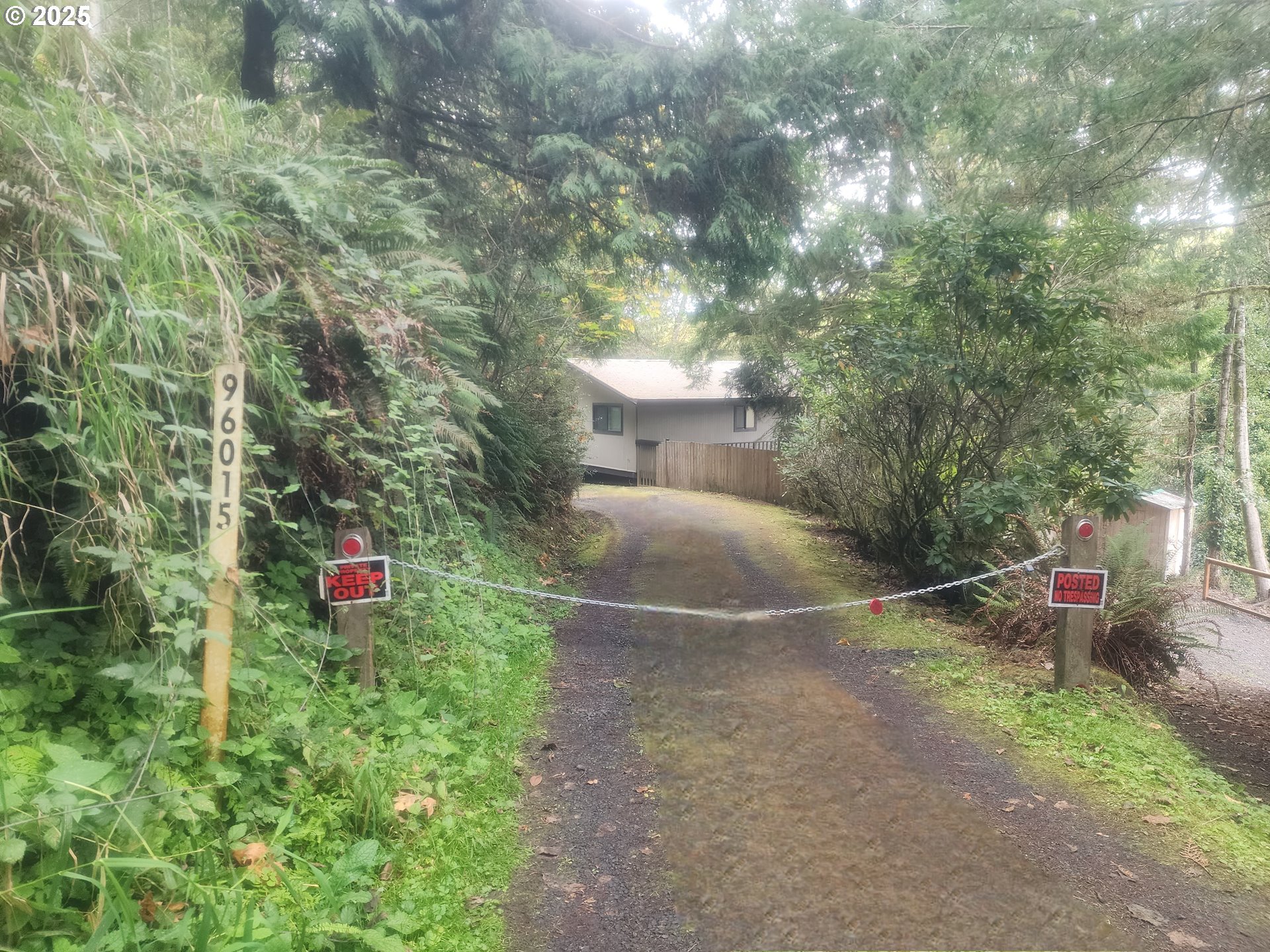 763 North Tenmile Lakeside, OR 97449 - Photo 6 of 47 a backyard of a house with chairs and wooden fence