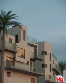 a front view of a house with plants