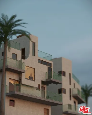 a front view of a house with plants