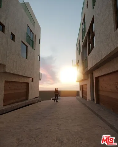 a view of empty room with stairs and windows