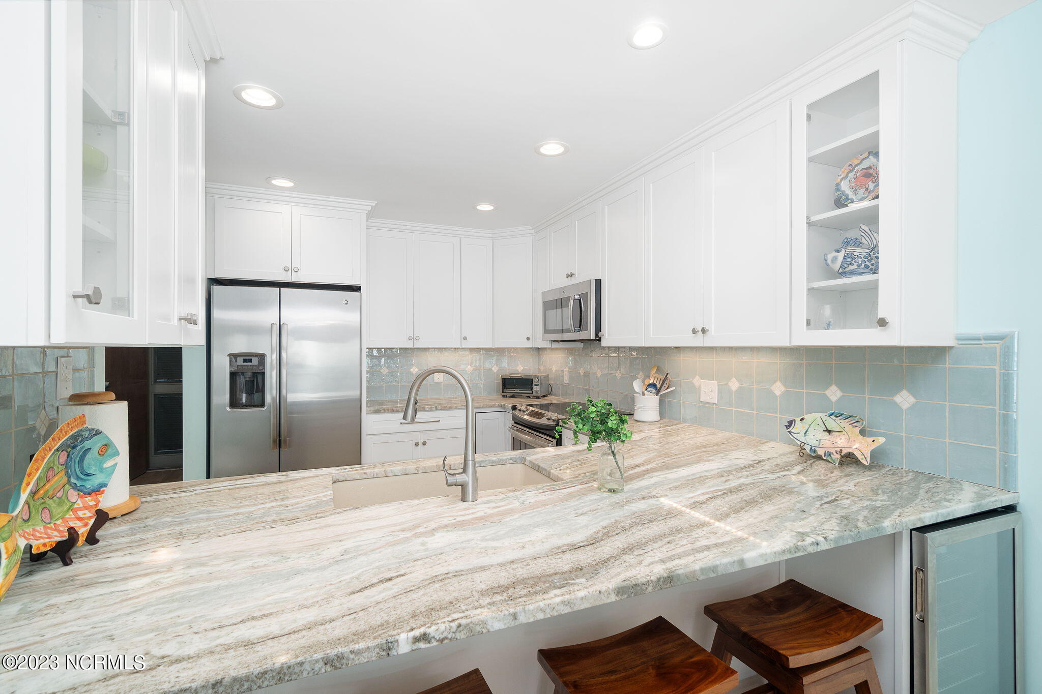 525 Salter Path Road, Unit A33 Atlantic Beach, NC 28512 - Photo 16 of 37 Kitchen w/ bar seating