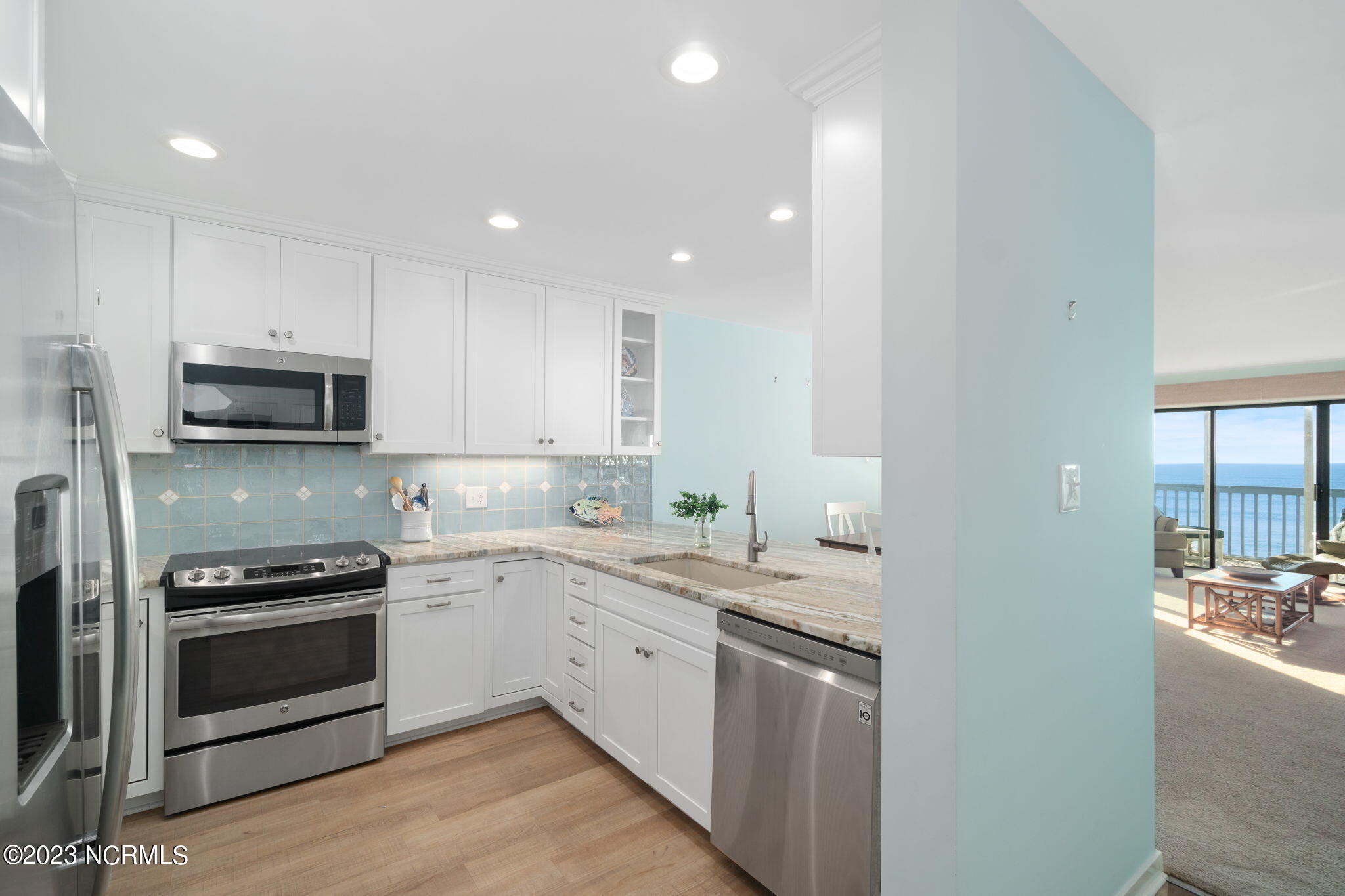 525 Salter Path Road, Unit A33 Atlantic Beach, NC 28512 - Photo 3 of 37 Kitchen w/ bar seating