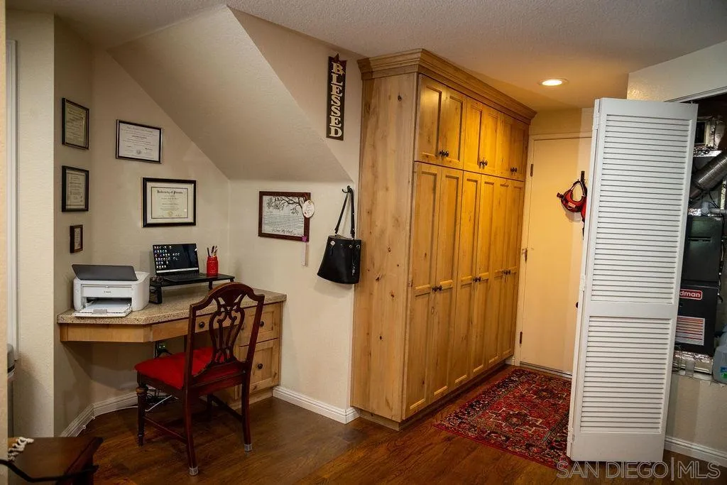 13890 Pinkard Way, Unit 68 El Cajon, CA 92021 - Photo 11 of 25 a view of a hallway with workspace and a window