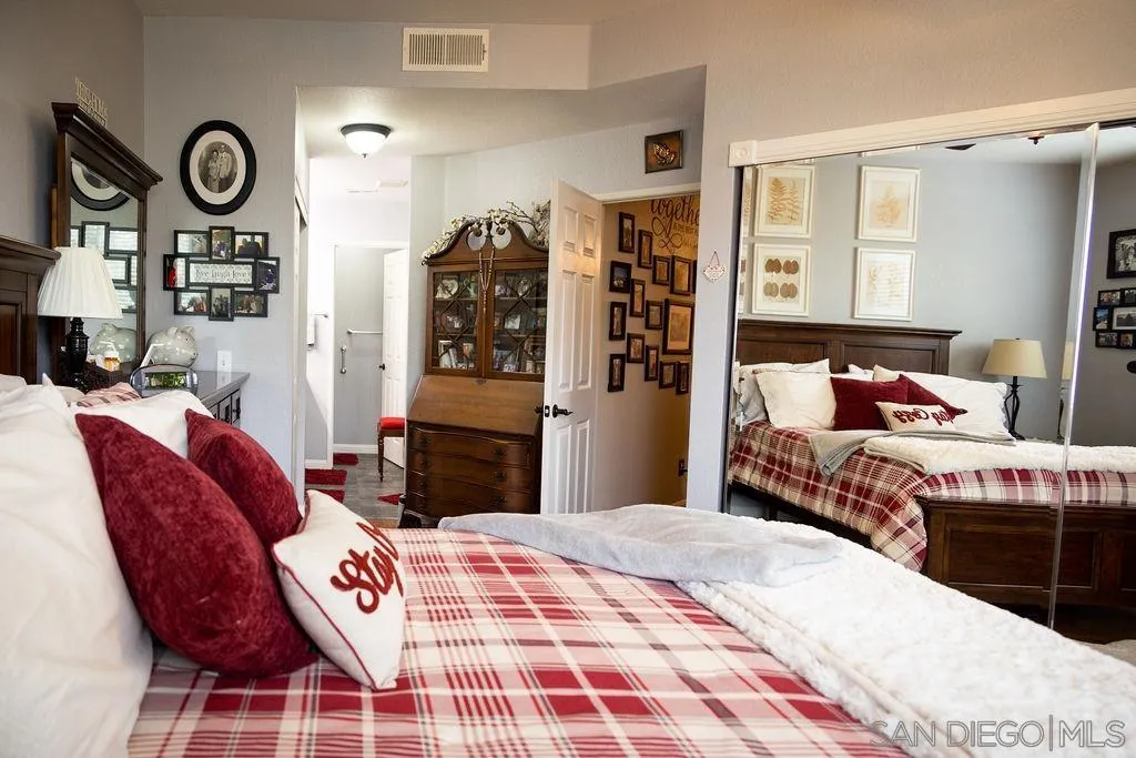 13890 Pinkard Way, Unit 68 El Cajon, CA 92021 - Photo 14 of 25 a bedroom with a bed and dresser