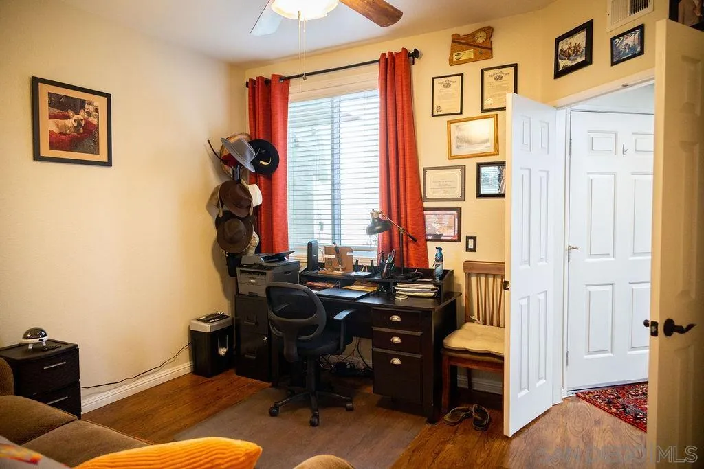 13890 Pinkard Way, Unit 68 El Cajon, CA 92021 - Photo 19 of 25 a livingroom with workspace and a window