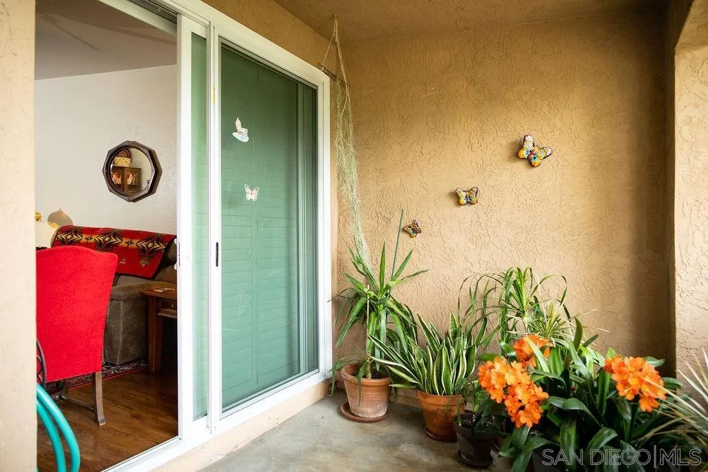 13890 Pinkard Way, Unit 68 El Cajon, CA 92021 - Photo 24 of 25 a view of a potted plant in front of a door
