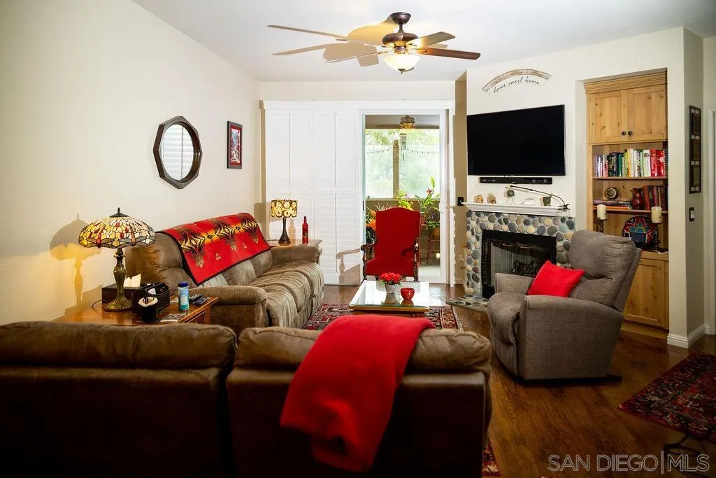 13890 Pinkard Way, Unit 68 El Cajon, CA 92021 - Photo 3 of 25 a living room with furniture and a flat screen tv