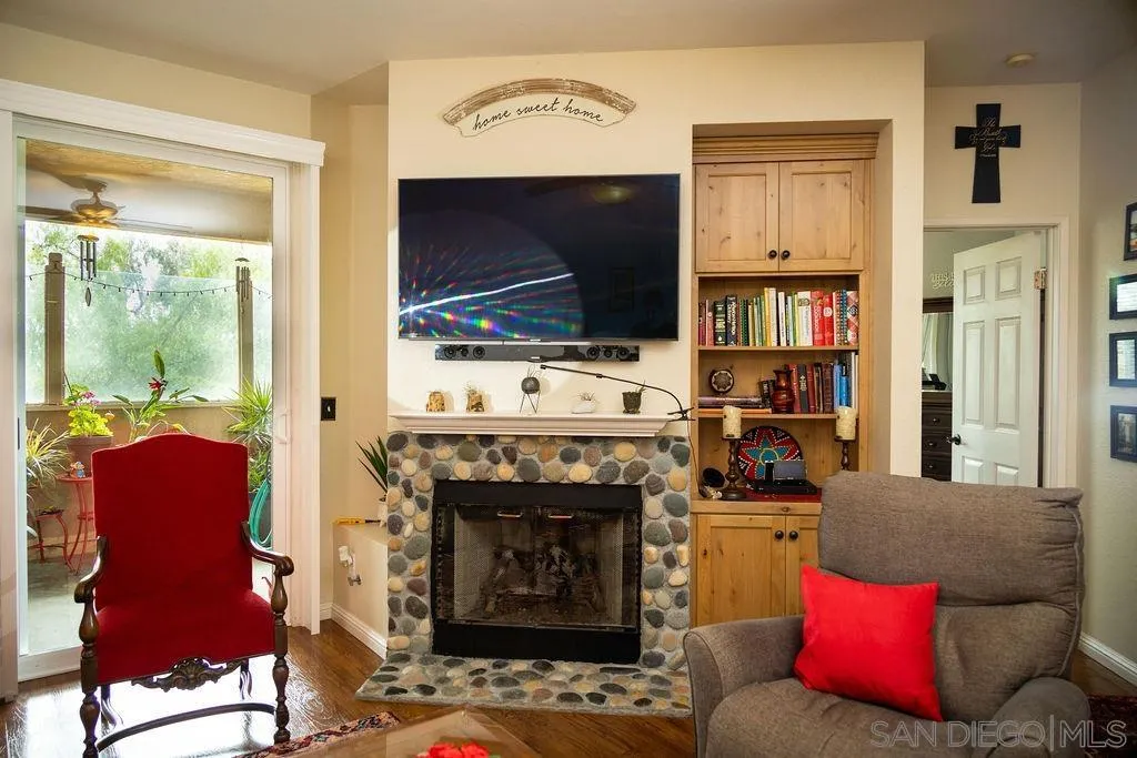 13890 Pinkard Way, Unit 68 El Cajon, CA 92021 - Photo 5 of 25 a living room with furniture and a flat screen tv