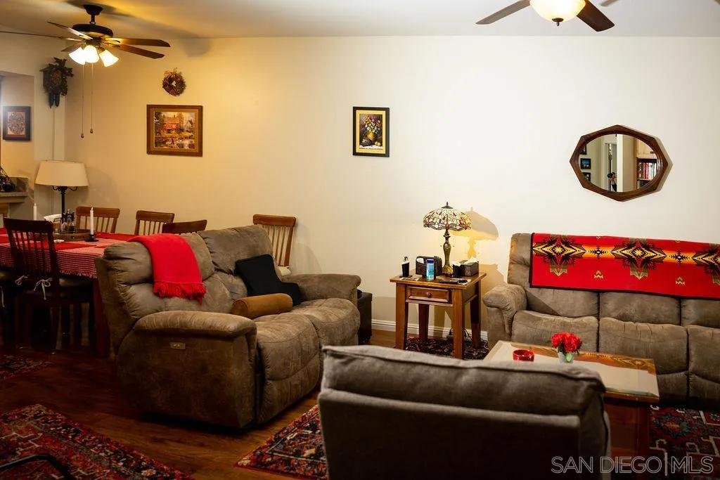 13890 Pinkard Way, Unit 68 El Cajon, CA 92021 - Photo 6 of 25 a living room with furniture and a lamp