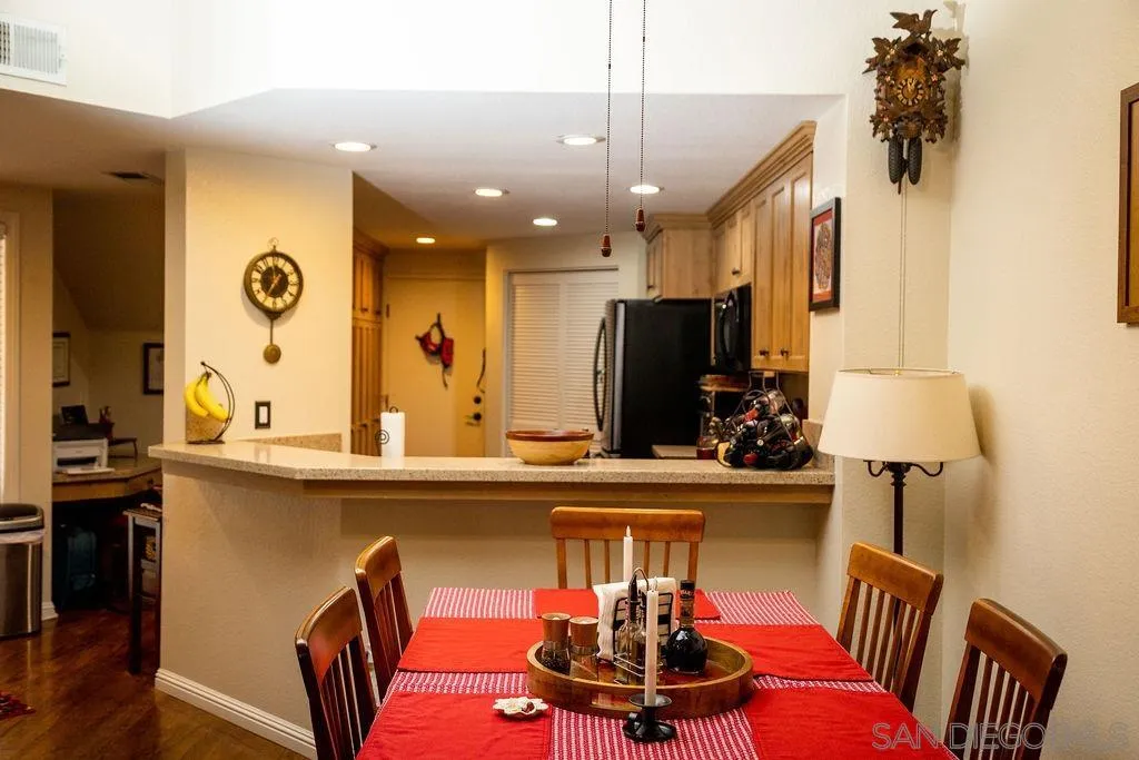 13890 Pinkard Way, Unit 68 El Cajon, CA 92021 - Photo 10 of 25 a view of a dining room with furniture and a chandelier