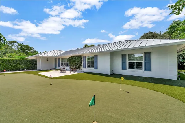 a view of house with swimming pool outdoor seating area and barbeque oven