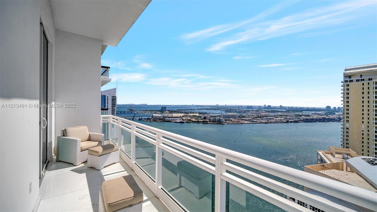 900 Brickell Key Boulevard, Unit 3103 Miami, FL 33131 - Photo 16 of 46 a view of a city from a balcony