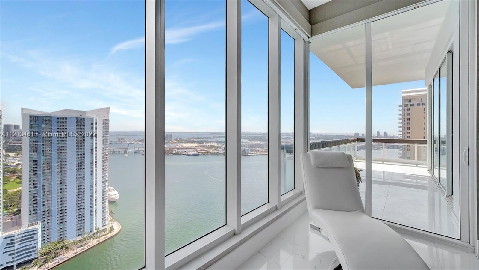 900 Brickell Key Boulevard, Unit 3103 Miami, FL 33131 - Photo 24 of 46 a view of a living room and a balcony