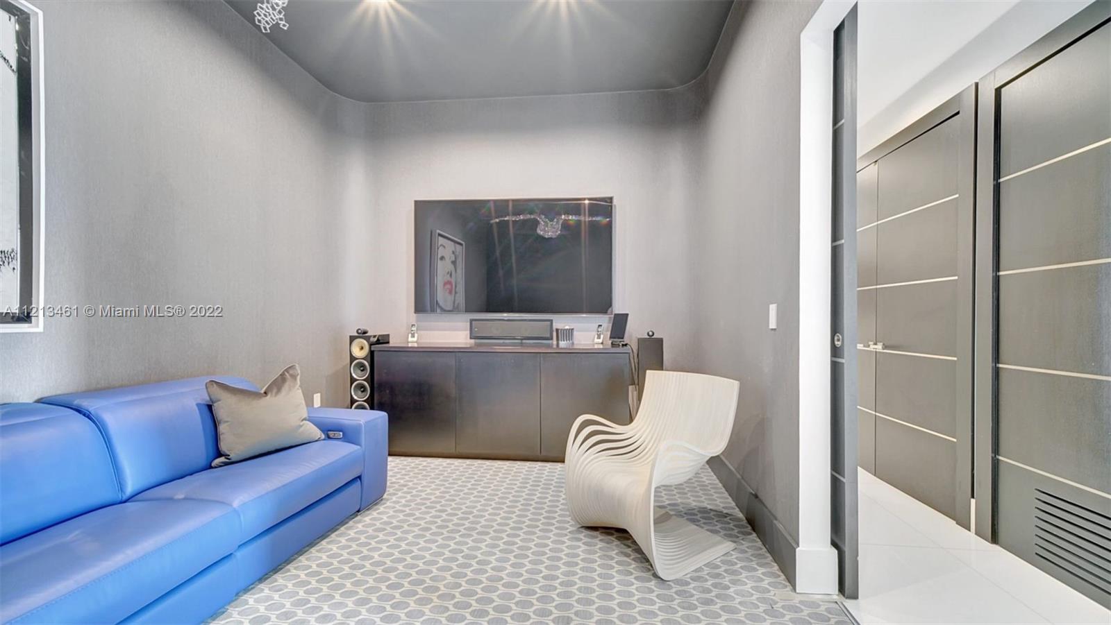 900 Brickell Key Boulevard, Unit 3103 Miami, FL 33131 - Photo 39 of 46 a living room with furniture