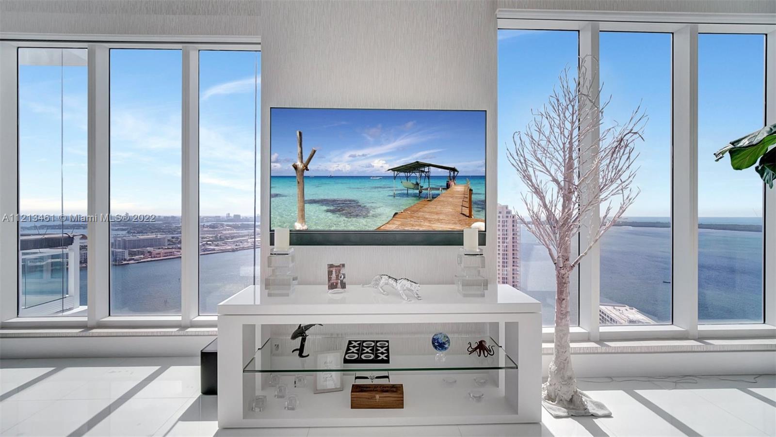 900 Brickell Key Boulevard, Unit 3103 Miami, FL 33131 - Photo 5 of 46 a view of living room with furniture and a potted plant