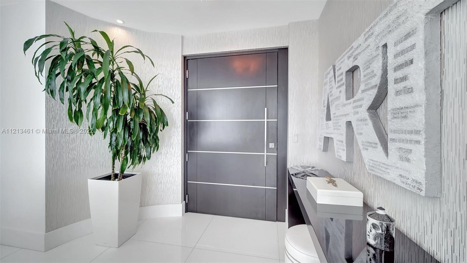 900 Brickell Key Boulevard, Unit 3103 Miami, FL 33131 - Photo 9 of 46 a bathroom with a toilet and a shower