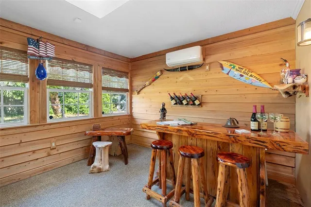 a room with chairs and window