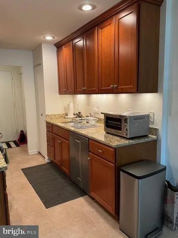 a open kitchen with stainless steel appliances granite countertop lots of counter top space