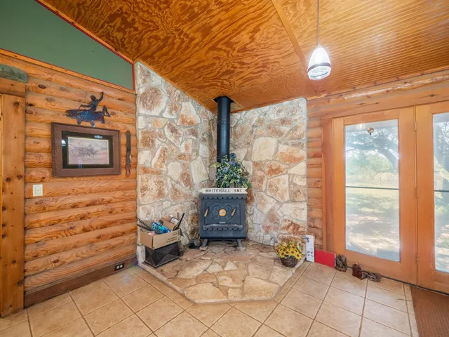 a living room with lots of furniture and a chandelier