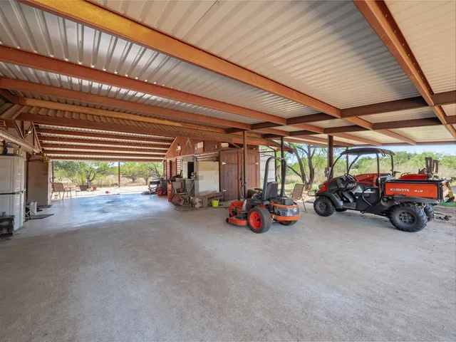 a view of a house with swimming pool and porch with furniture
