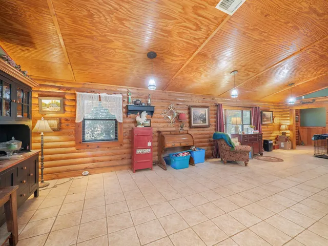 a view of a patio with table and chairs