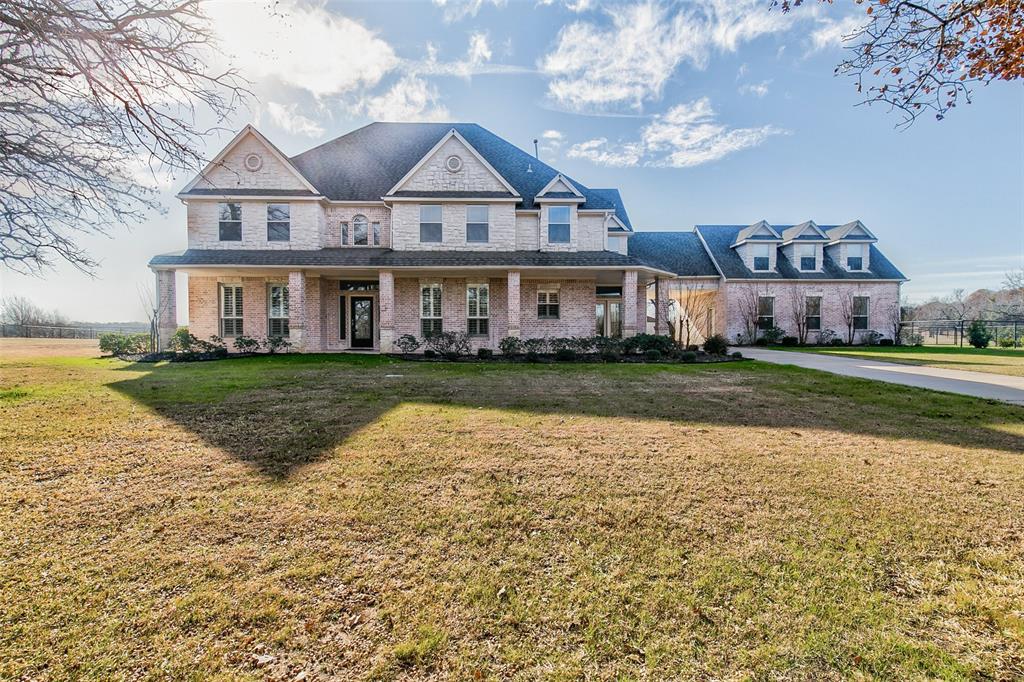 259 King Ranch Court Fort Worth, TX 76108 - Photo 1 of 1 a view of a house with a big yard and large trees