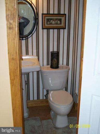 1202 Robin Court Halethorpe, MD 21227 - Photo 13 of 18 a bathroom with a toilet and a sink