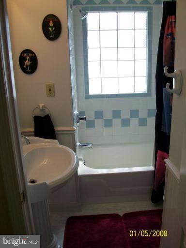 1202 Robin Court Halethorpe, MD 21227 - Photo 14 of 18 a bathroom with a bathtub