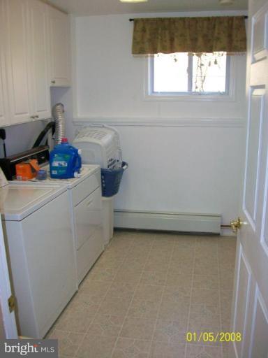 1202 Robin Court Halethorpe, MD 21227 - Photo 16 of 18 a utility room with dryer and window