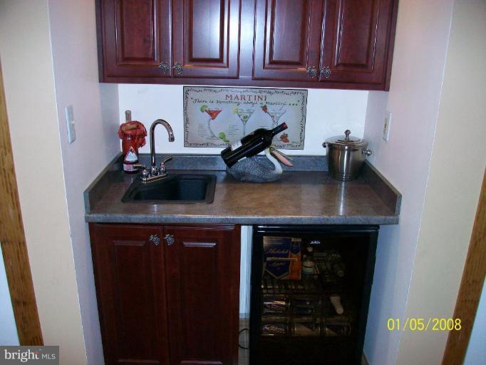 1202 Robin Court Halethorpe, MD 21227 - Photo 3 of 18 a kitchen with a sink and cabinets