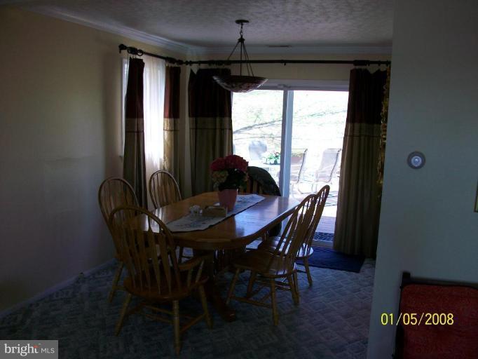 1202 Robin Court Halethorpe, MD 21227 - Photo 10 of 18 a dining room with furniture window and outside view